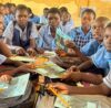 Group of school children holding books